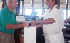 H.H.V. Whitchurch's Gairy Aird and ship's captain exchange gifts
