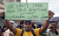 A man holds up a sign at the protest