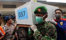 Carrying the bodies of passenger who died in the plane crash