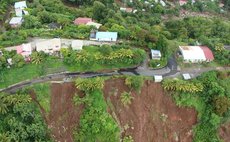  A road and houses on the edge of the cliff in Petite Savanne