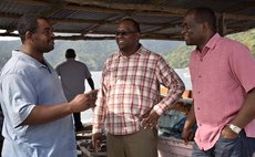 Pinard , centre, and PM Skerrit meet Soufriere man during recent visit (OPM Photo)