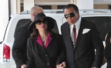 Former boxer Muhammad Ali (R) and his wife Lonnie Ali arrive for the visitation and funeral service for boxing legend Angelo Dundee at the Countryside Christian Center in Clearwater, Florida, February