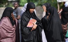 Students wait for latest news at the entrance of Moi University campus in Garissa, Kenya, April 03, 2015