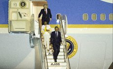   U.S. President Barack Obama (front) arrives at the Norman Manley International Airport in Kingston, Jamaica, April 8, 2015