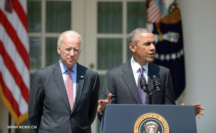 U.S. President Barack Obama and Vice President Joe Biden attend a press conference at the White House in Washington, the United States, July 1, 2015. 