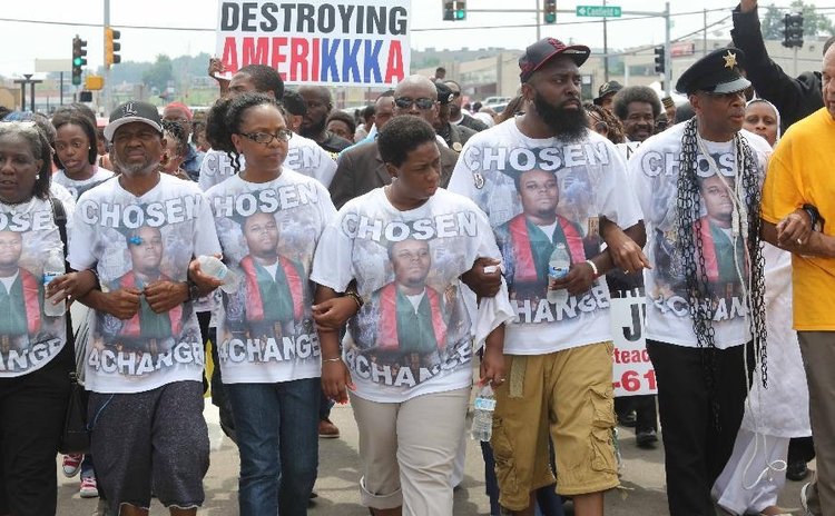 Michael Brown's father (5th L), Michael Brown Sr. leads a march in Ferguson, Missouri, U.S., on August 9, 2015.
