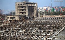 Photo taken on Aug. 13, 2015 shows burnt vehicles near the core area of the explosion site in Tianjin, north China.