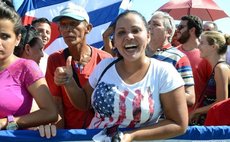 People attend flag-raising ceremony at the U.S. embassy in Havana, Cuba, Aug. 14, 2015.