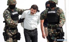 File photo taken on Feb. 22, 2014 shows Mexico's Navy (SEMAR) members, guarding the drug trafficker Joaquin Guzman Loera, alias "El Chapo" Guzman (C)