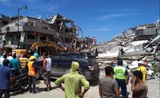  CHONE, April 17, 2016 (Xinhua) -- Residents stand in front of the debris of houses after an earthquake in the city of Chone, Manabi Province, Ecuador, on April 17, 2016. 