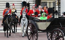 Britain's Queen Elizabeth II and her husband Prince Philip leave Buckingham Palace to attend the Queen's Birthday Parade "Trooping the Color" during the Queen's 90th official birthday celebrations