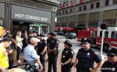 CLEVELAND, June 22, 2016 (Xinhua) -- Photo taken by a mobile device shows police officers standing guard near a shooting scene in Cleveland, the United States on June 22, 2016. 