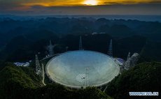 Picture of the nearly-done project of FAST taken on June 27, 2016 (Photo by Xinhua photojournalist Ou Dongqu). 