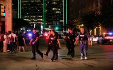 DALLAS, July 8, 2016 (Xinhua) -- Police cars gather around the El Centro College parking garage following the sniper shooting in downtown Dallas, the United States, July 7, 2016. 