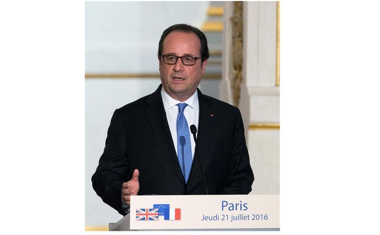 French President Francois Hollande speaks at a press conference after meeting with British Prime Minister Theresa May