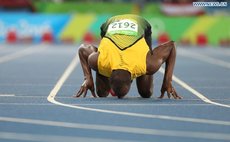 Jamaica's Usain Bolt celebrates after the men's 200m final of Athletics at the 2016 Rio Olympic Games in Rio de Janeiro, Brazil, on Aug. 18,2016. Usain Bolt won the gold medal. (Xinhua/Wang Lili)