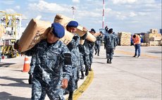 Bolivian military personnel prepare relief goods destined for hurricane-ravaged Haiti at an airport in Santa Cruz, Bolivia, on Oct. 8, 2016. (Xinhua/R. Martinez Candia/ABI) 