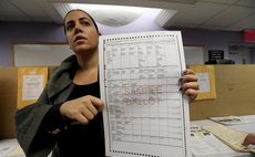 Valerie Vazquez, director of communications of the New York City board of elections, introduces the ballot-casting process for journalists during a Pre-Election Voting Demonstration on Nov. 7, 2016