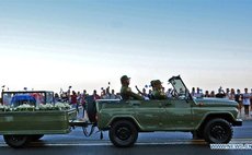 The caravan carrying the urn that holds the ashes of Cuban revolutionary leader Fidel Castro is greeted by people at Malecon Habanero Avenue in Havana, capital of Cuba, on Nov. 30, 2016