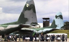 Coffins of the Chapecoense players and coaches killed Monday in a plane crash are seen being loaded onto aircraft of Brazilian Air Force at the Rionegro Military Base in the outskirts of Medellin