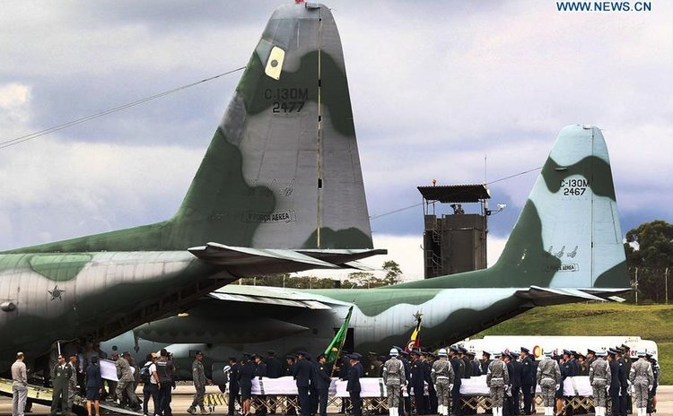 Coffins of the Chapecoense players and coaches killed Monday in a plane crash are seen being loaded onto aircraft of Brazilian Air Force at the Rionegro Military Base in the outskirts of Medellin