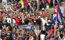 People greet the caravan carrying the ashes of Cuban revolutionary leader Fidel Castro upon its arrival in Santiago de Cuba, southeastern Cuba, on Dec. 3, 2016