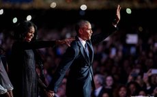 president Obama and Michele Obama wave farewell to crowd after speech