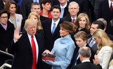 U.S. President Donald Trump(L) takes the oath of office during the presidential inauguration ceremony at the U.S. Capitol in Washington D.C., the United States, on Jan. 20, 2017