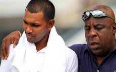 Windwards manager Lockhart Sebastien consoles Trinidad captain Danesh Ramdin after Windwards crush Trinidad to make it to the finals of the regional 4-day cricket tournament