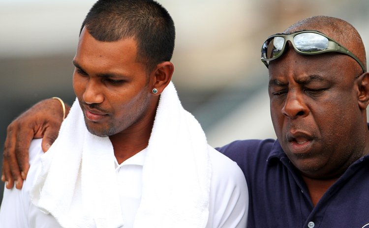 Windwards manager Lockhart Sebastien consoles Trinidad captain Danesh Ramdin after Windwards crush Trinidad to make it to the finals of the regional 4-day cricket tournament