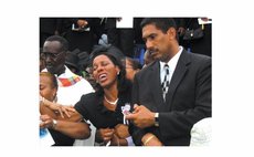 Mrs Charles at the funeral of Pierre Charles