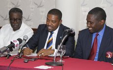 Dave cameron of the WICB, centre,and Wavell Hinds of the WIPA and Clive Llyod at the signing ceremony