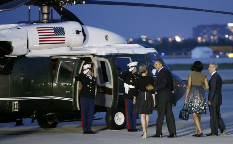 US President and wife Michele Obama arrive in Chicago in 2012
