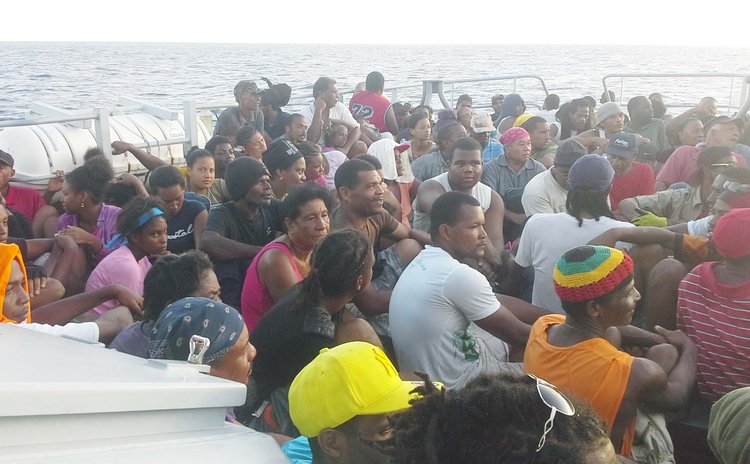 Petite Savanne residents leave on a coast guard vessel to Roseau