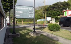 Sign showing latest changes in prices of gas, kerosene and diesel at the NP filling station in Canefield