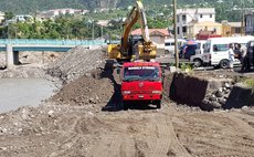 Dominica Strong truck working on bank of the Roseau River