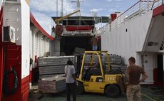Parts of Bailey Bridges are being unloaded