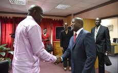 Prime Minister Roosevelt Skerrit greets Trinidad Envoy brian Lara