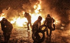 MOSCOW, Jan. 23, 2014 (Xinhua) -- Protestors clash with police in Kiev, Ukraine, Jan. 22, 2014. At least two demonstrators were reported to have been killed in Kiev on Wednesday morning during clashes