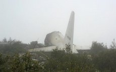 Feb. 11, 2014 (Xinhua) -- Photo taken on Feb. 11, 2014 shows the site of a military plane crash in Oum El Bouaghi Province, Algeria. As many as 76 people were killed on Tuesday when a C-130 Hercules m