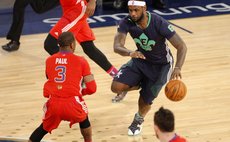 NEW ORLEANS, Feb. 17, 2014 (Xinhua) -- LeBron James of the Miami Heat (R) runs with the ball during the 2014 NBA All-Star Game against Western Conference in New Orleans