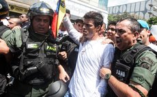 CARACAS, Feb. 18, 2014 (Xinhua) -- Venezuelan opposition leader Leopoldo Lopez (2nd R) is arrested by the national guard in Chacaito, Caracas, Venezuela, on Feb. 18, 2014