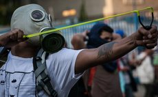 CARACAS, Feb. 20, 2014 (Xinhua) -- A student participates in a protest in Altamira, in the municipality of Chacao, Caracas, Venezuela, on Feb. 19, 2014. (Xinhua/Boris Vergara)