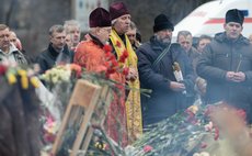 KIEV, Feb. 28, 2014 (Xinhua) -- People mourn victims of clashes in Kiev, capital of Ukraine, on Feb. 28, 2014. (Xinhua/Jia Yuchen)(bxq)