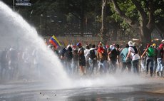 CARACAS, March 5, 2014 (Xinhua) -- Demonstrators are dispersed with water during clashes with the Bolivarian National Police in a protest in Altamira, in the Chacao municipality, Venezuela, on March 4