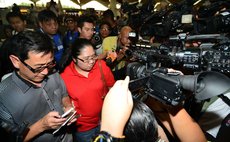 KUALA LUMPUR, March 8, 2014 (Xinhua) -- Relatives of passengers on the missing Malaysian Airlines plane receive interviews at Kuala Lumpur International Airport, Malaysia, March 8, 2014. 