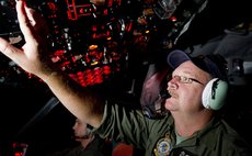 CANBERRA, March 24, 2014 (Xinhua) -- Royal Australian Air Force  Officer Neil Scott-Jackson on board an AP-3C Orion after searching the southern Indian Ocean for Malaysia Airlines flight MH370.