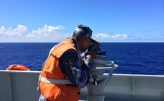 ABOARD JINGGANGSHAN, April 13, 2014 (Xinhua) -- A sailor aboard Chinese navy's amphibious landing vessel Jinggangshan scans the ocean in search for the missing Malaysia Airlines. 