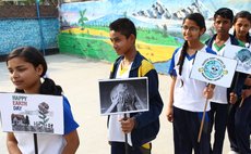 KATHMANDU, April 22, 2014 (Xinhua) -- Nepalese children display placards during the celebration of the World Earth Day in Kathmandu, capital of Nepal, on April 22, 2014. 