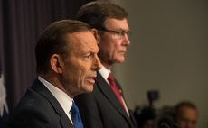 CANBERRA, April 28, 2014 (Xinhua) -- Australian Prime Minister Tony Abbott (L) speaks about MH370 with Joint Agency Coordinator Angus Houston in Canberra, Australia, on April 28, 2014. 